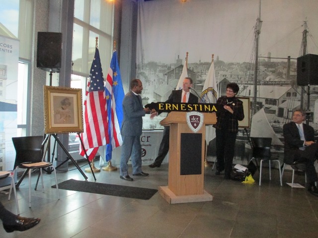 IMG_0005 (640x480) (Left) Cape Verde’s Consul General to Boston Pedro Graciano Gomes de Carvalho receives the "Ernestina" quarterboard removed when the new Ernestina-Morrissey quarterboard were installed. Center DCR Commissioner Jack Murray, right Laura Pires-Hester