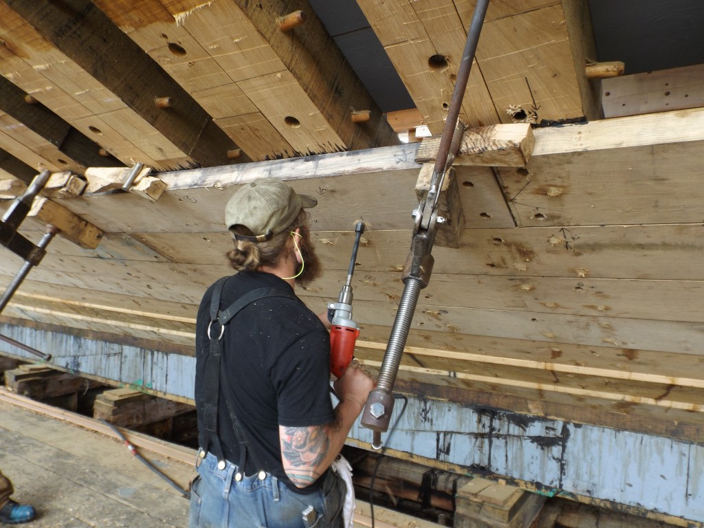 As the holes are drilled the ceiling clamps hold the plank tight to the frame and to the adjacent plank.