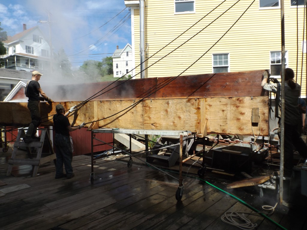 Preparing to hoist the plank from the steam box