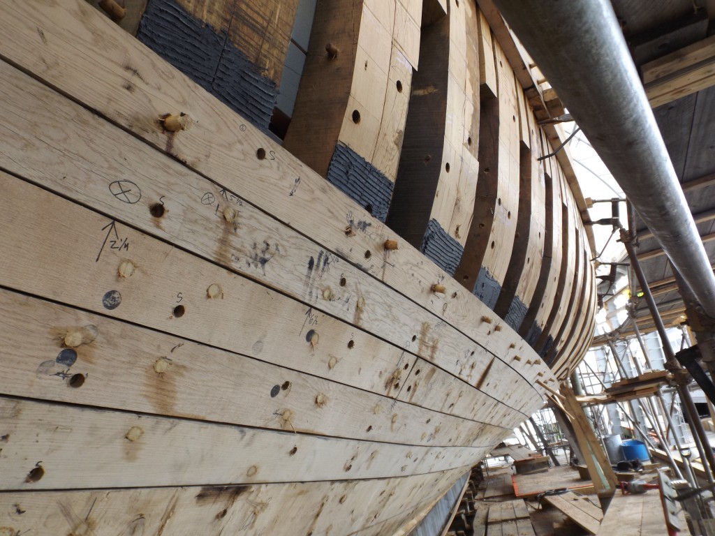 You can see the notations on these planks that guide the crew's placement of the plank fastenings.