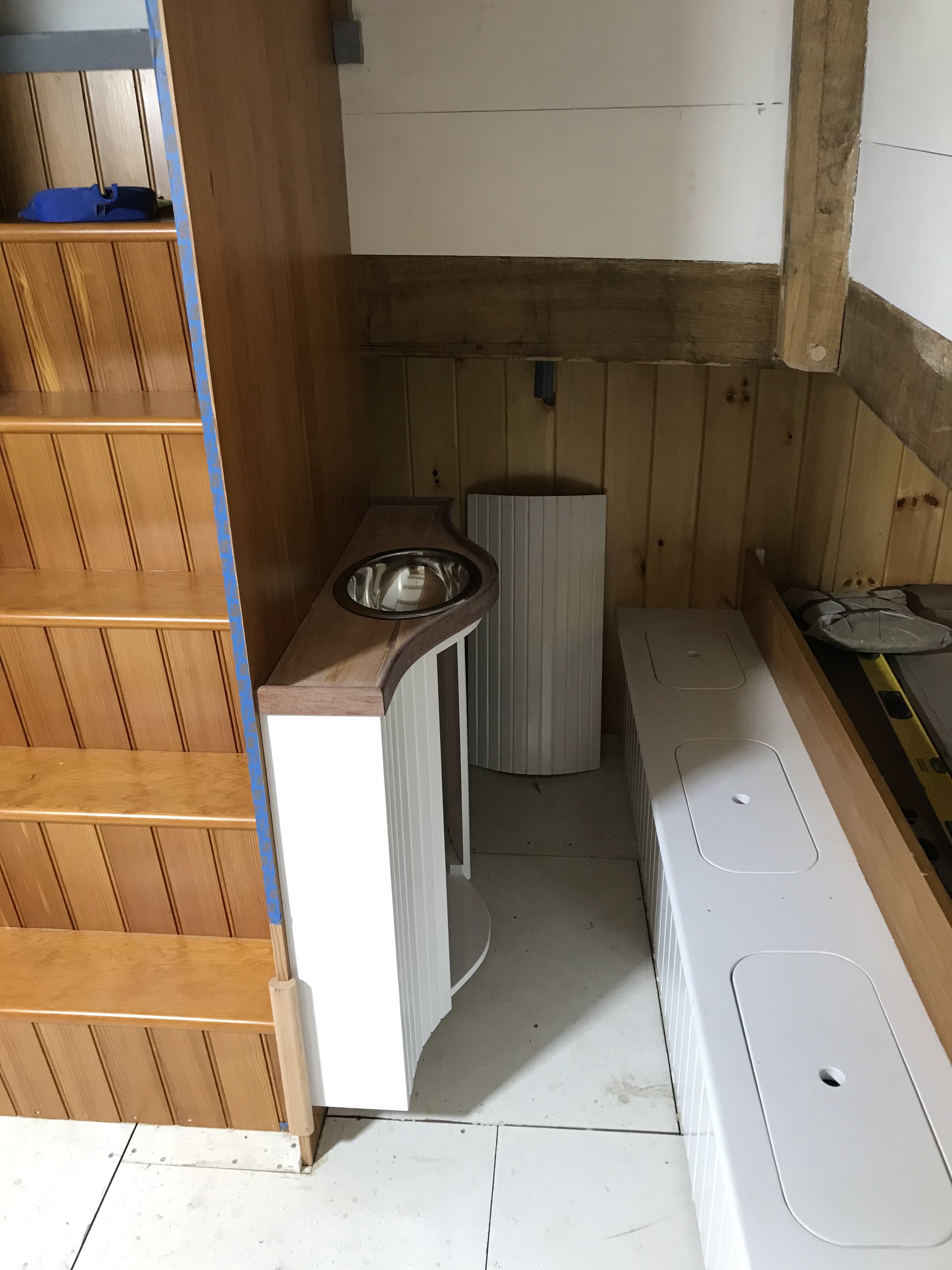 The Aft Cabin sink has been installed, and looks terrific!  The cupboard door will remain off until the plumbing is completed in the next couple of weeks.  Once everything is hooked up, a final coat of varnish will be applied before the entire unit is wrapped in protective coverings until sea trials next summer!