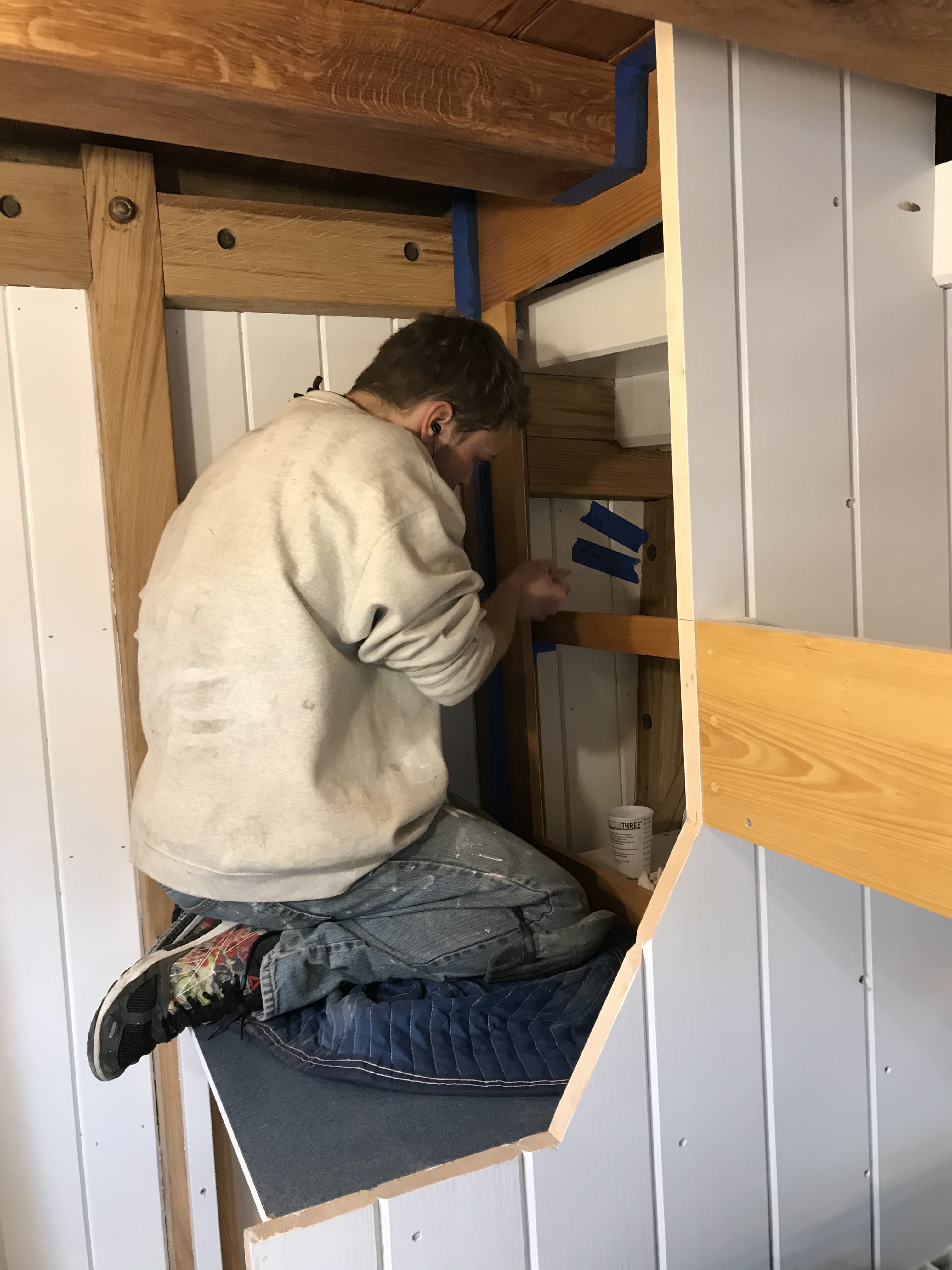 Kevin is hard at work coating the storage lockers in the Main Cabin.  The paint team has been busy in almost every corner of the ship recently as they try to stay ahead of carpentry installations.  The finishes look terrific.