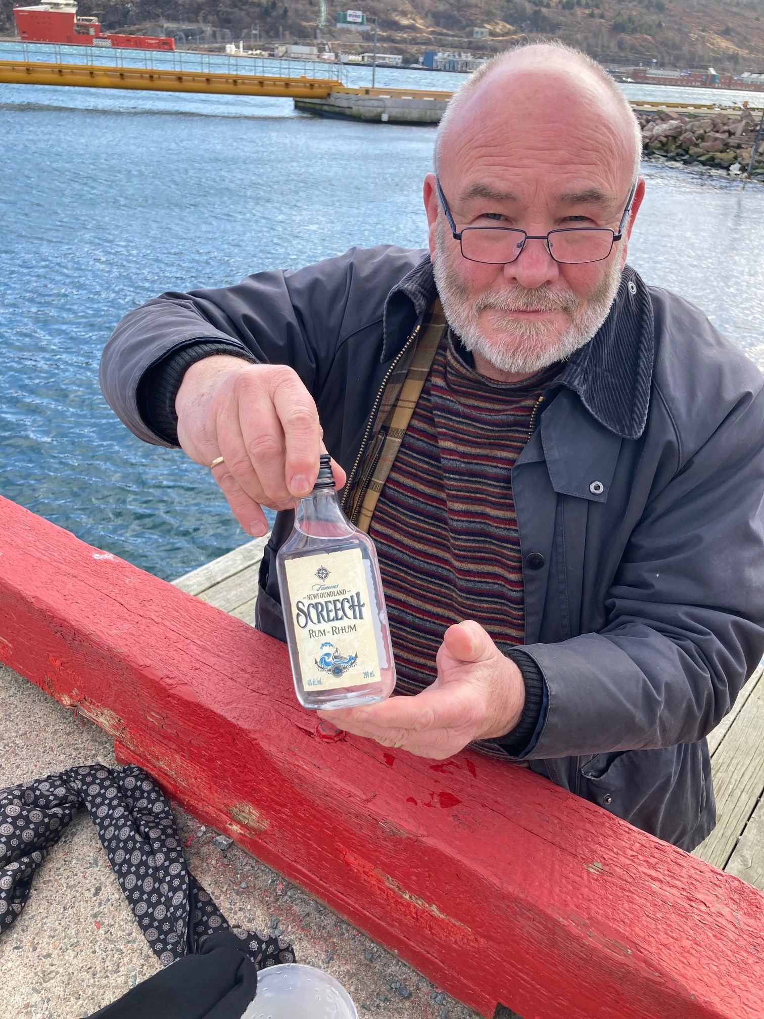 ‫  Jim Dempsey chose an appropriate container for his sample of Newfoundland water!