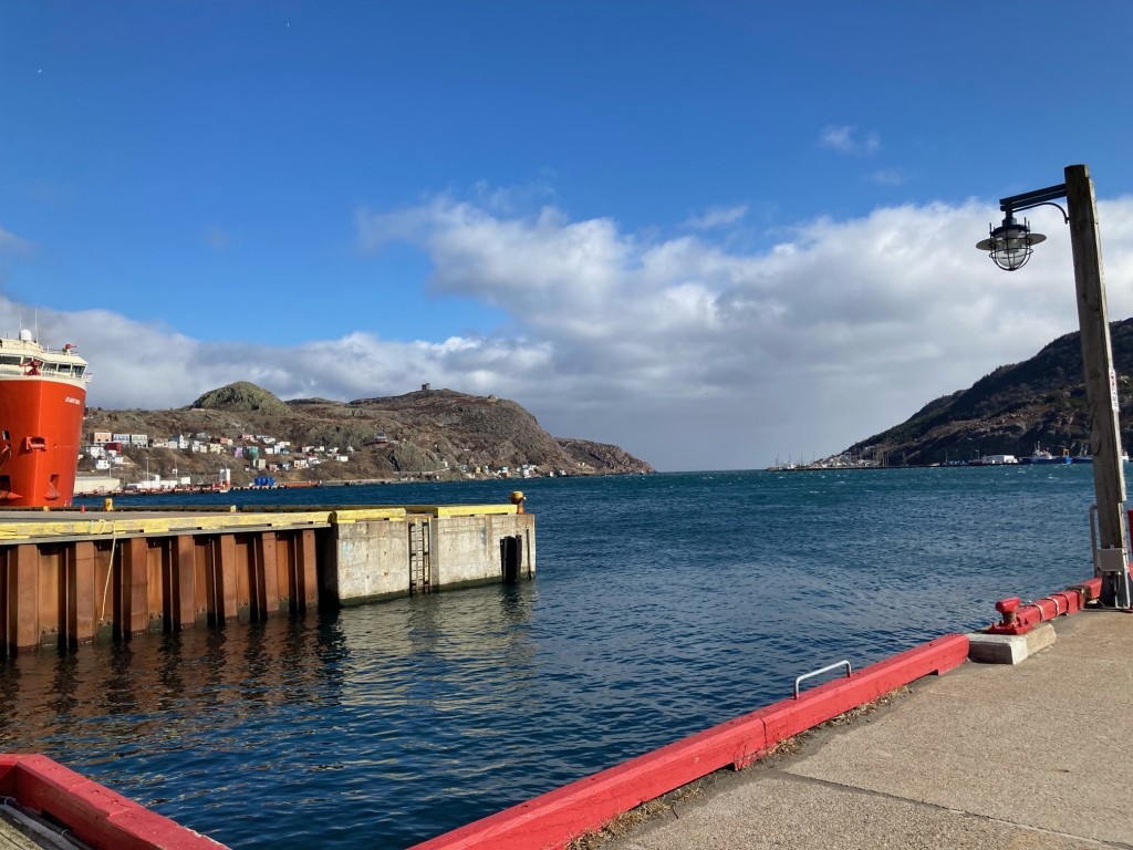 St John's Harbor, NL with Signal Hill in the background a the entrance to the harbor.