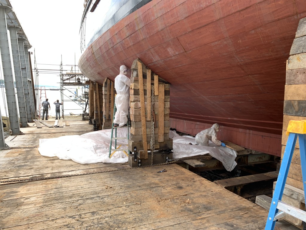 Meanwhile Captain Krihwan has assigned some of her crew to sand the bottom.  They will do the painting too.