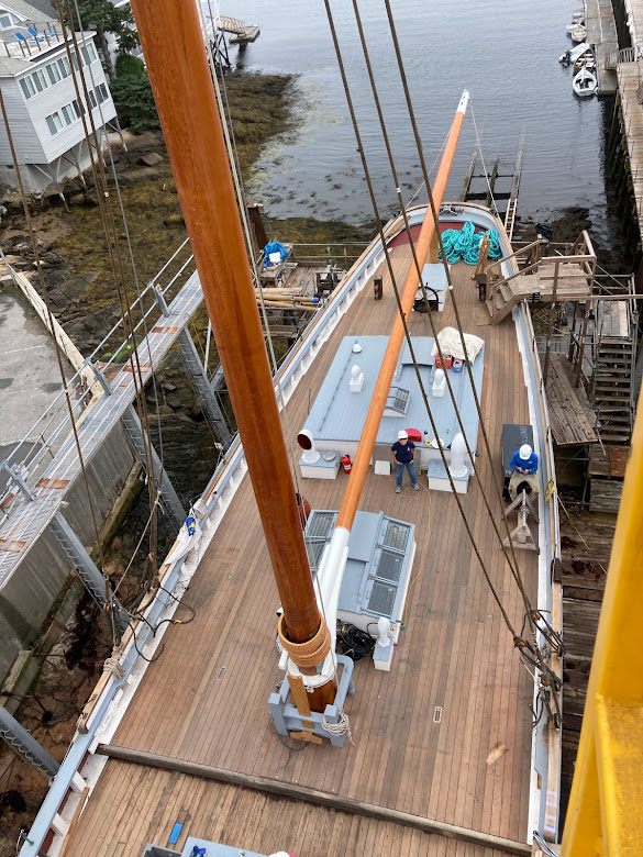 Looking down to the aft deck. The boom is in place. Captain Krihwan inspects.